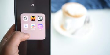 a person holding a cell phone in their hand