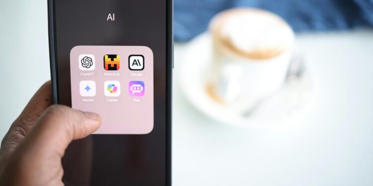 a person holding a cell phone in their hand